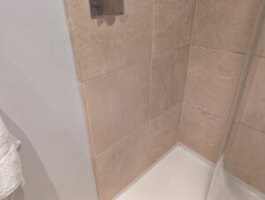 AFTER Travertine Shower Tile Etch Restoration in Rugby, Warwickshire