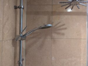 AFTER Travertine Shower Tile Etch Restoration in Rugby, Warwickshire