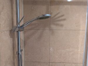 AFTER Travertine Shower Tile Etch Restoration in Rugby, Warwickshire